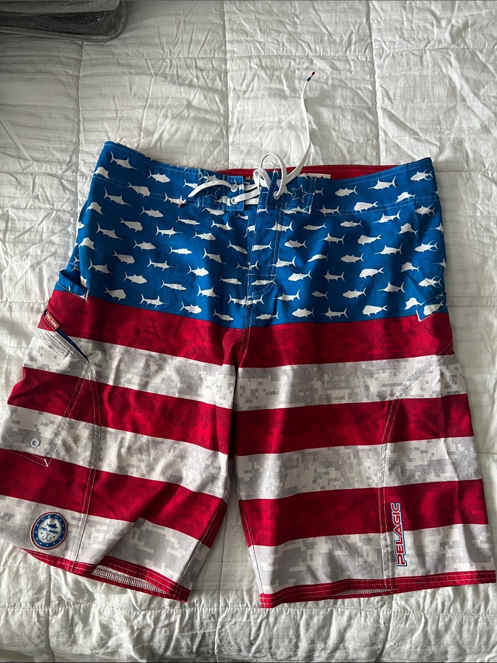 Pelagic Men’s Red, White & Blue Shark Stripe Board Shorts